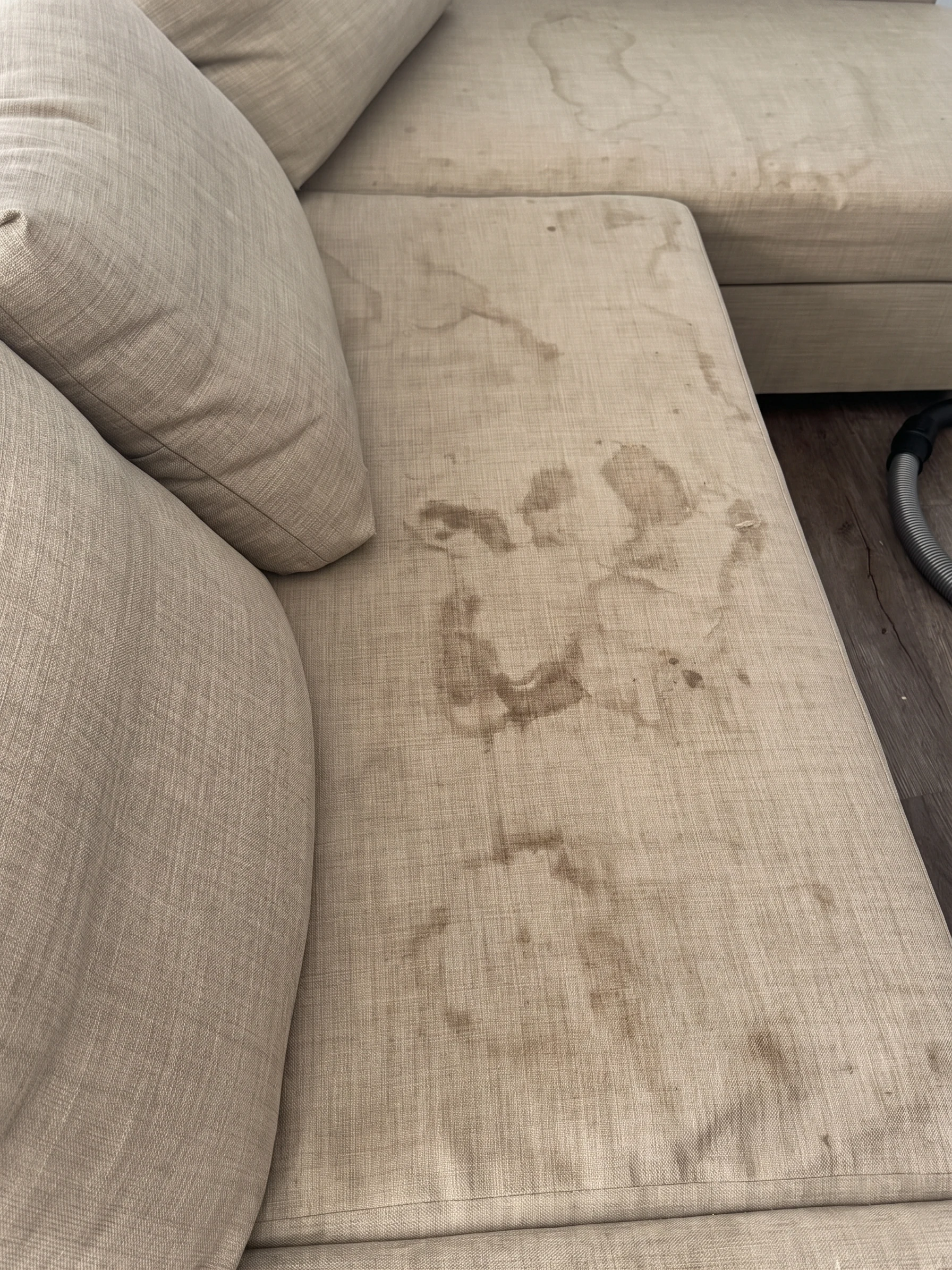Sofa before cleaning showing visible soiling
